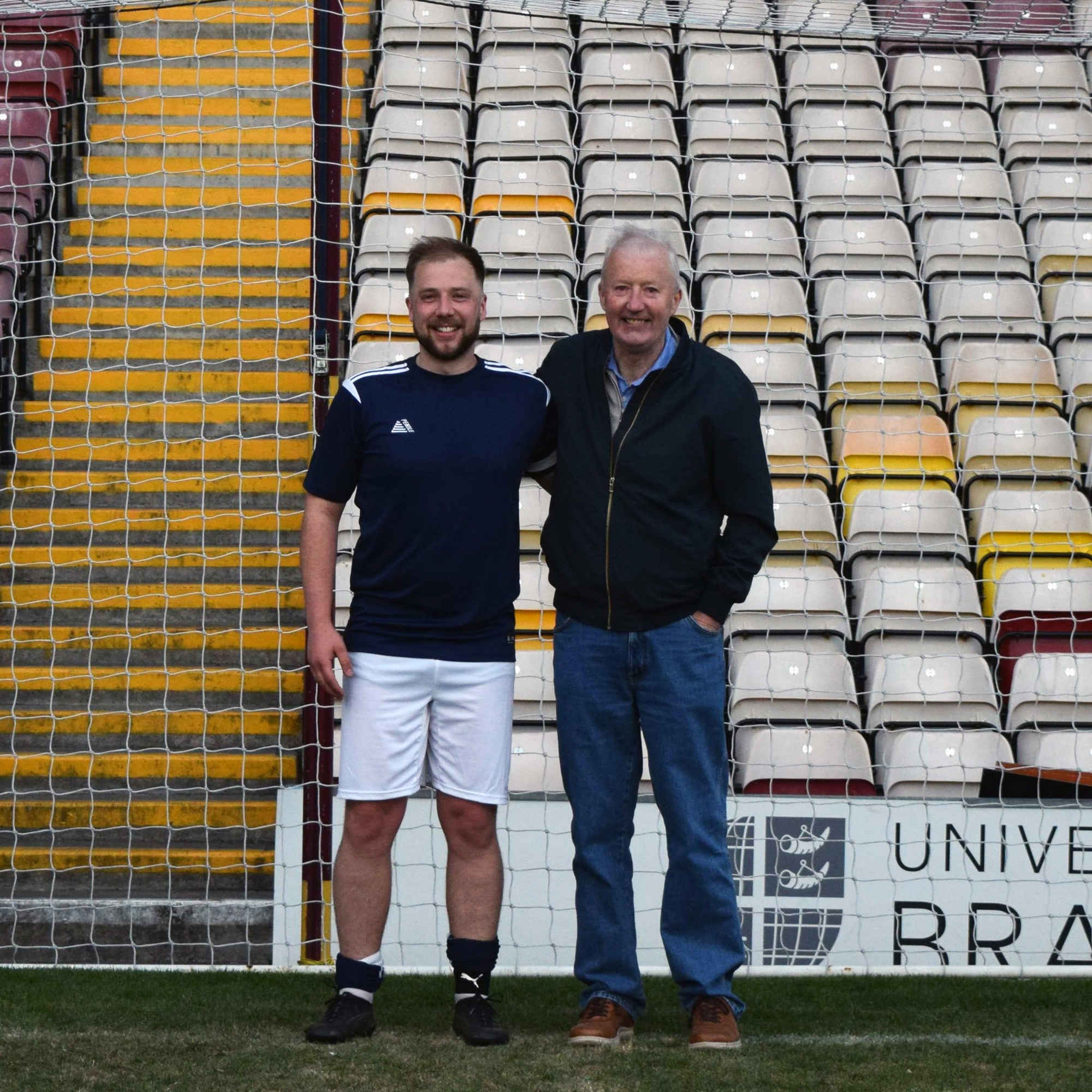 Danny Dixon pictured alongside his dad on the Bradford City FC pitch