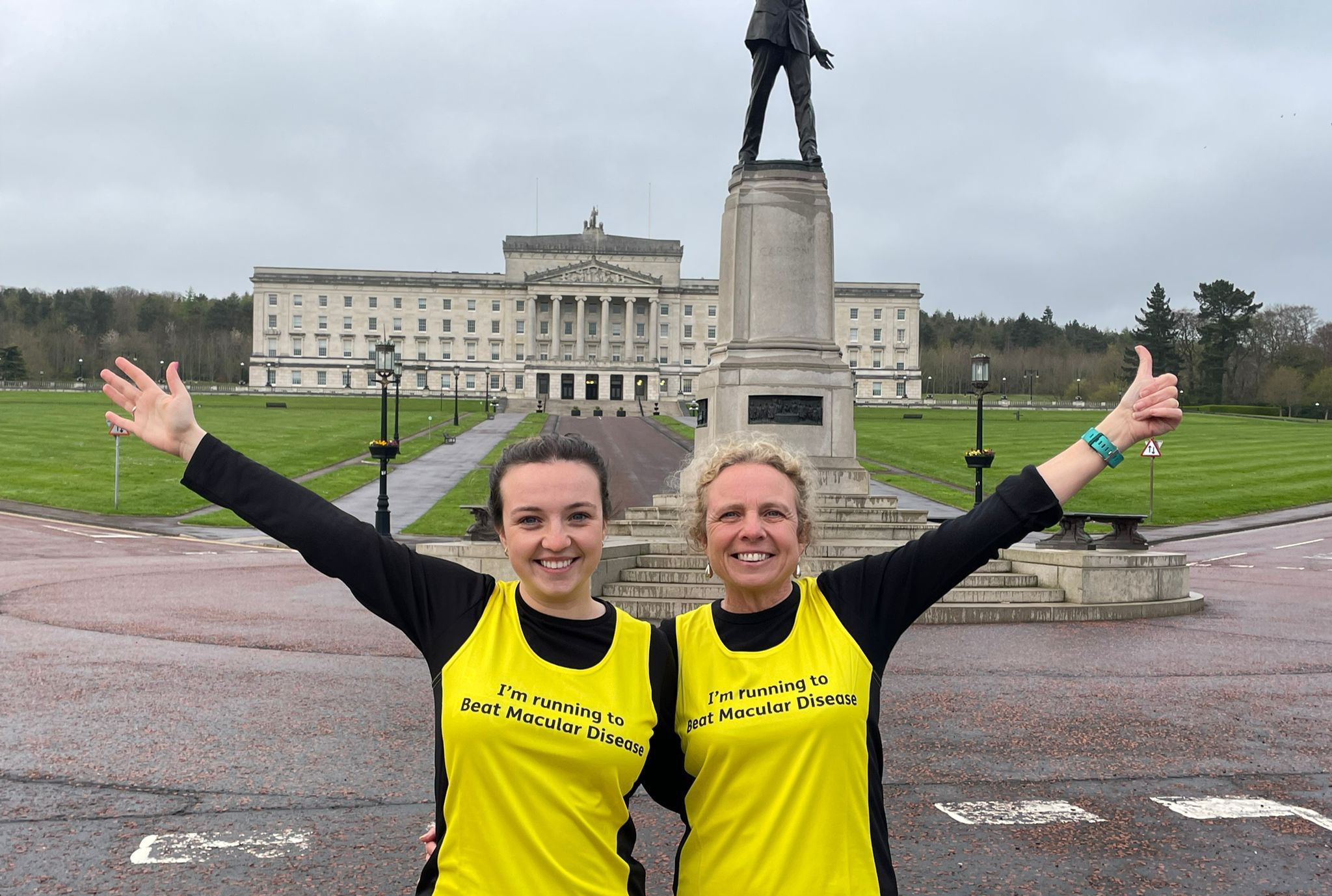 Claire and Patricia prepare for the Belfast Marathon 2022 in front of building 