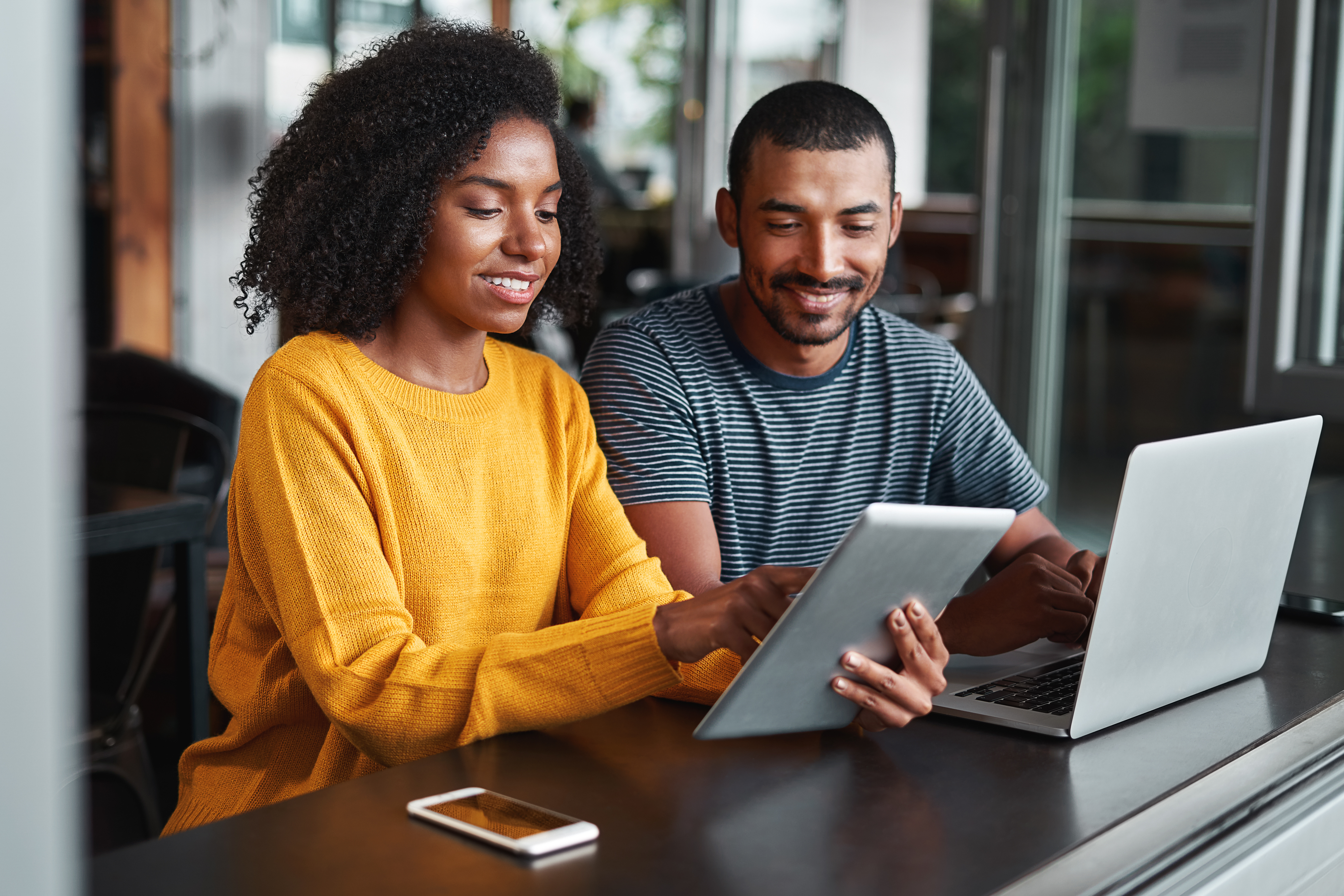  couple looking at a tablet together