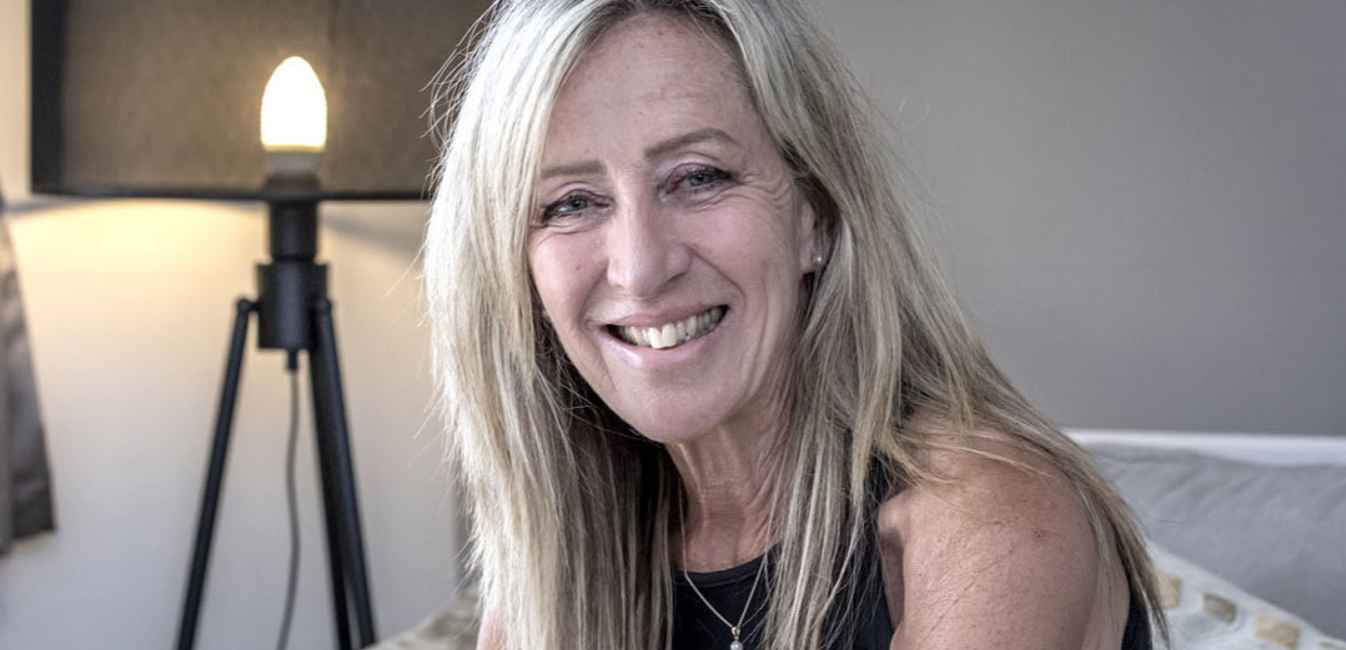 Gill smiling and looking to camera