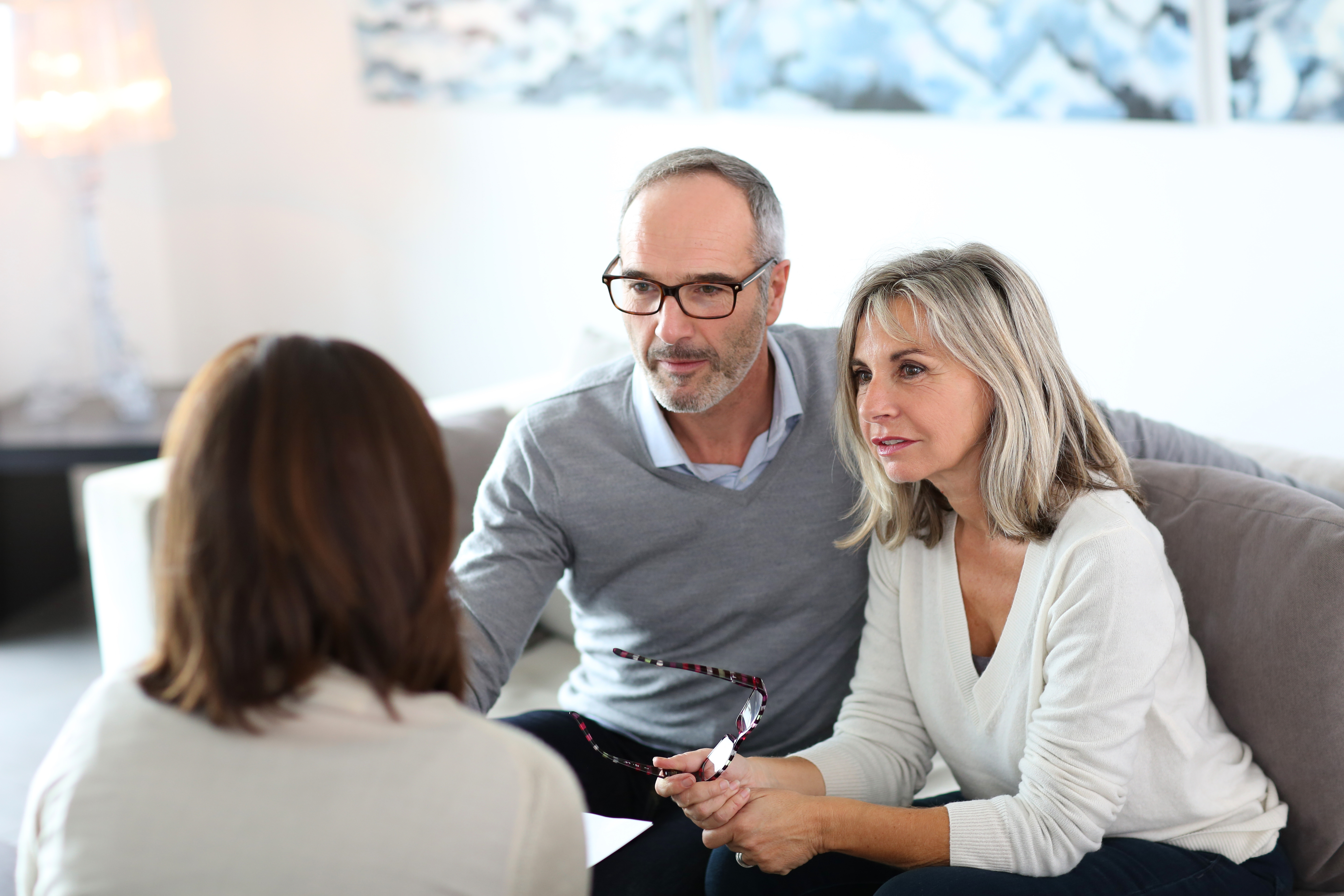 Couple having a discussion with a funeral director