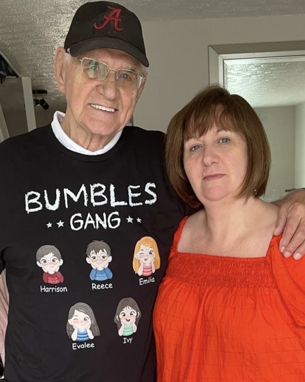 Maria with her father, Sidney smiling and hugging