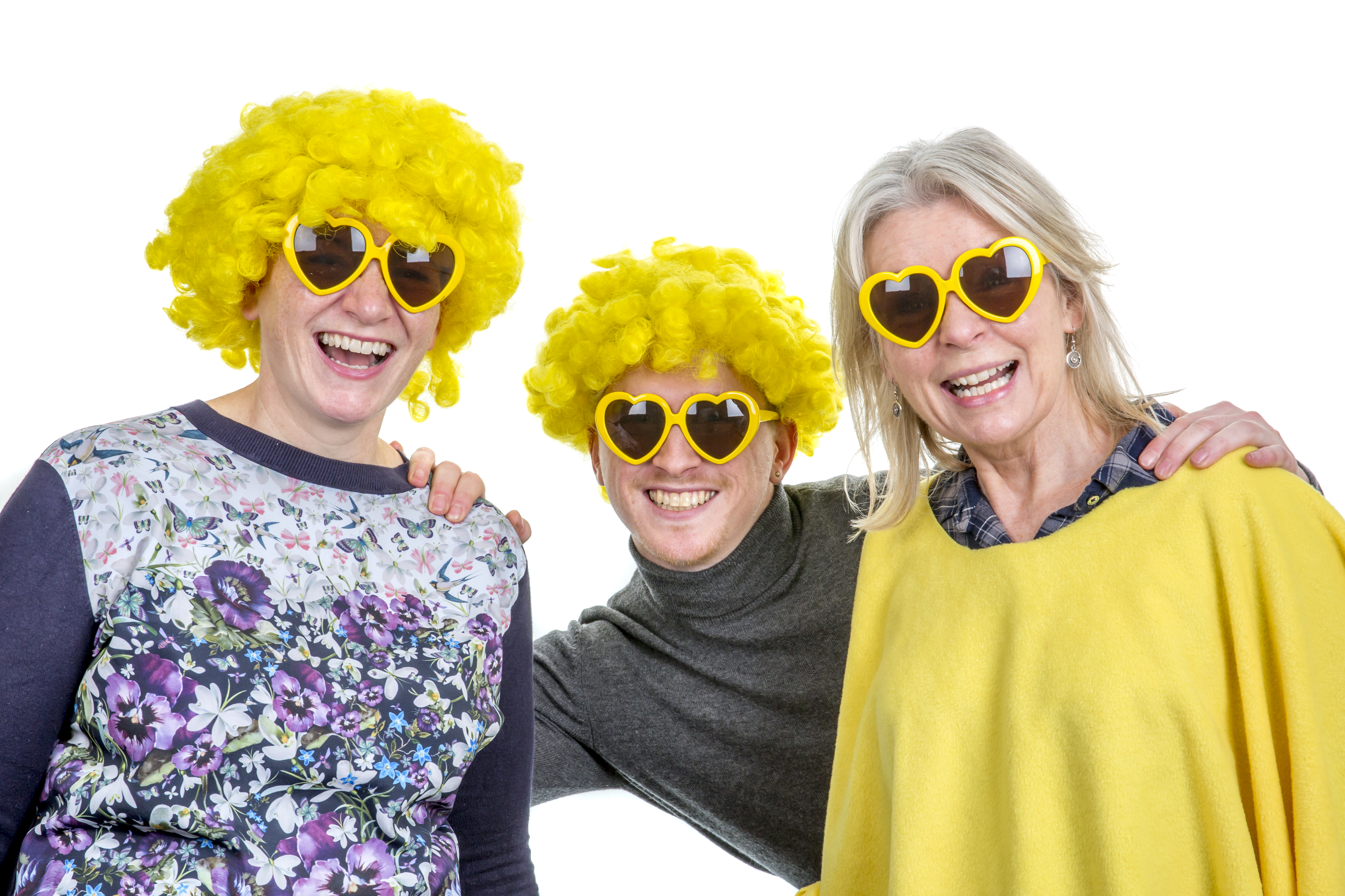 Three people wearing yellow wigs and sunglasses 