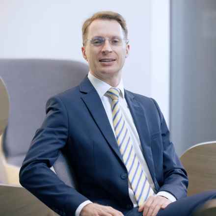 Richard Gale, wearing a suit and glasses