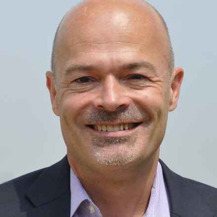 Tim Jackson smiling into camera