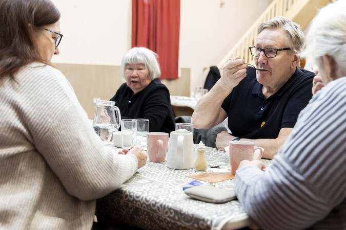 group gathering drinking tea