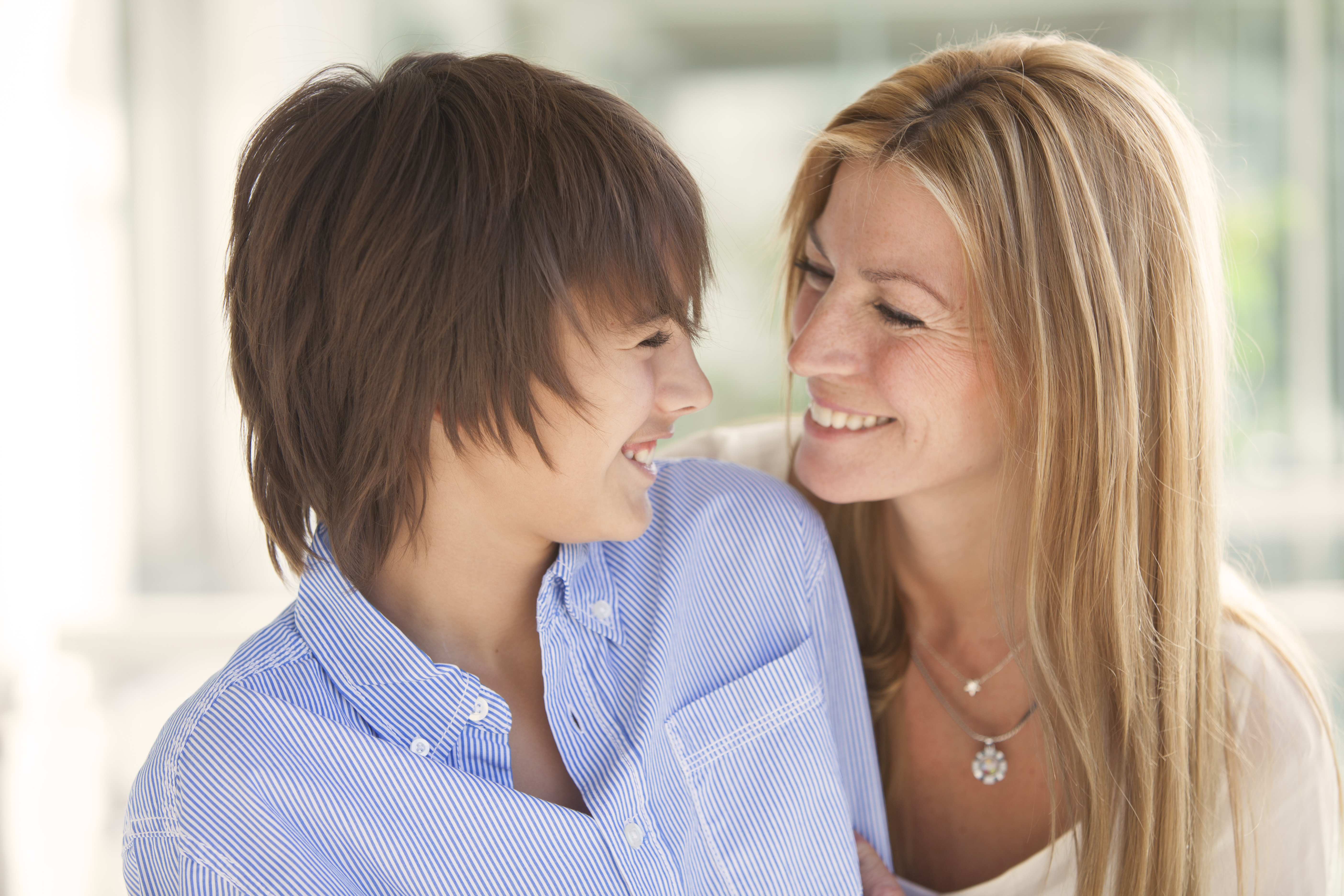 Mother and son smiling at each other 